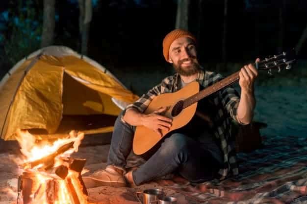 guitarist-camping-night-by-campfire_23-2148223488.jpg